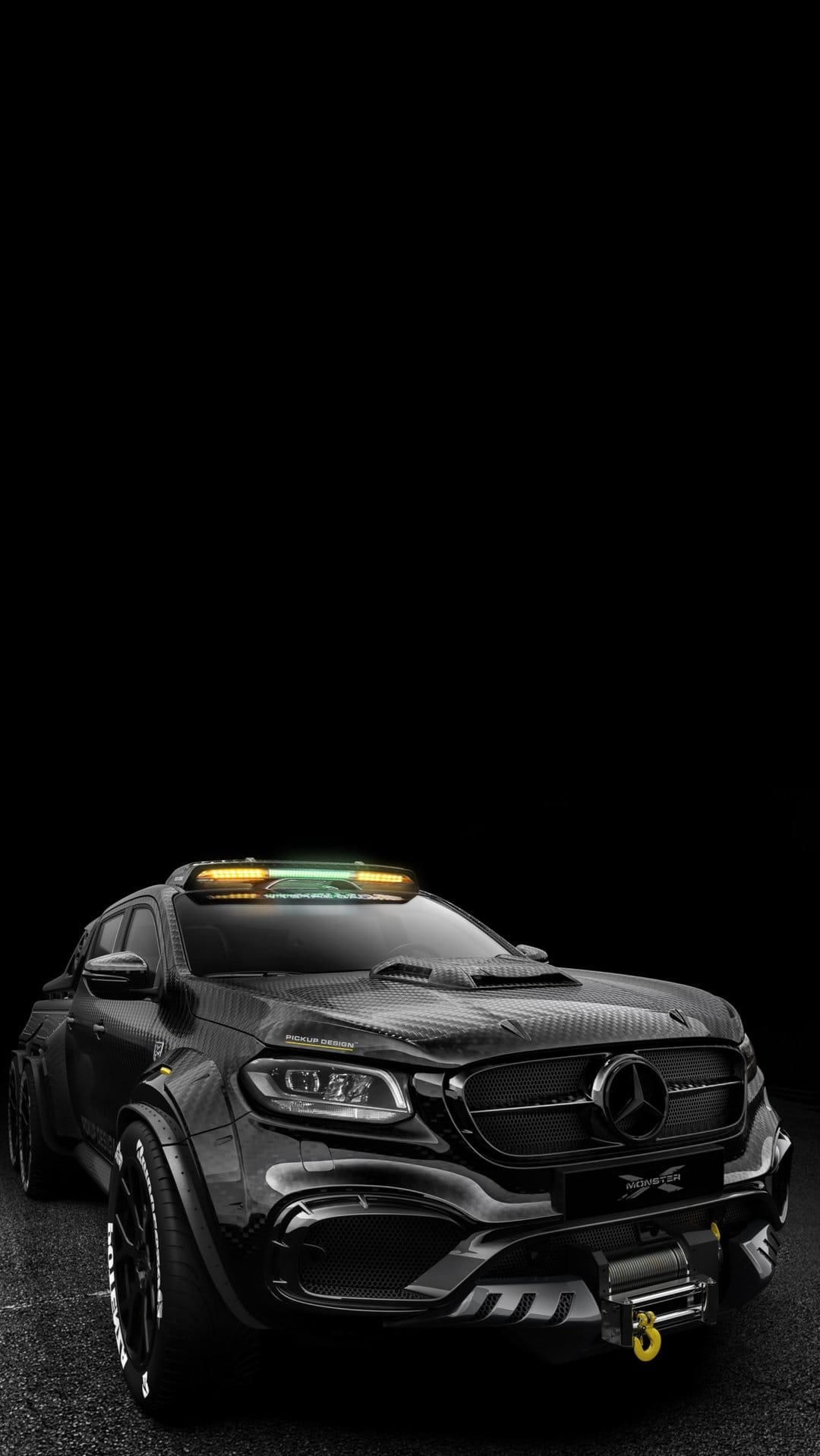 Mercedes X-Class pickup truck with wide fenders, carbon fiber body kit, winch, and roof-mounted light bar.
