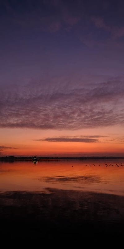 Sunset, Reflection, Water, Sky, Orange, Purple, Serene, Lake, Ocean, Tranquil, Horizon, Nature, Landscape, Beautiful, Peaceful, Dusk, Dawn, Vibrant, Birds, Scenery