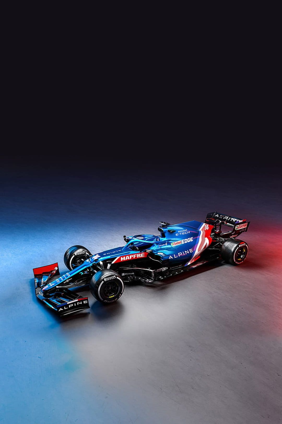 Alpine Formula 1 car featuring a blue livery and red accents sits on a dark reflective studio surface.
