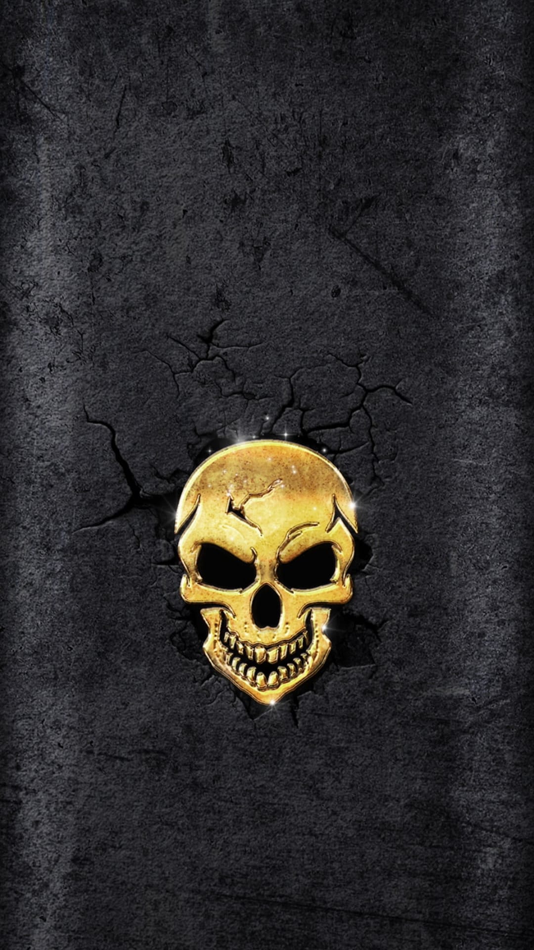 Golden human skull with reflective surfaces resting on a black background featuring deep geometric cracks.