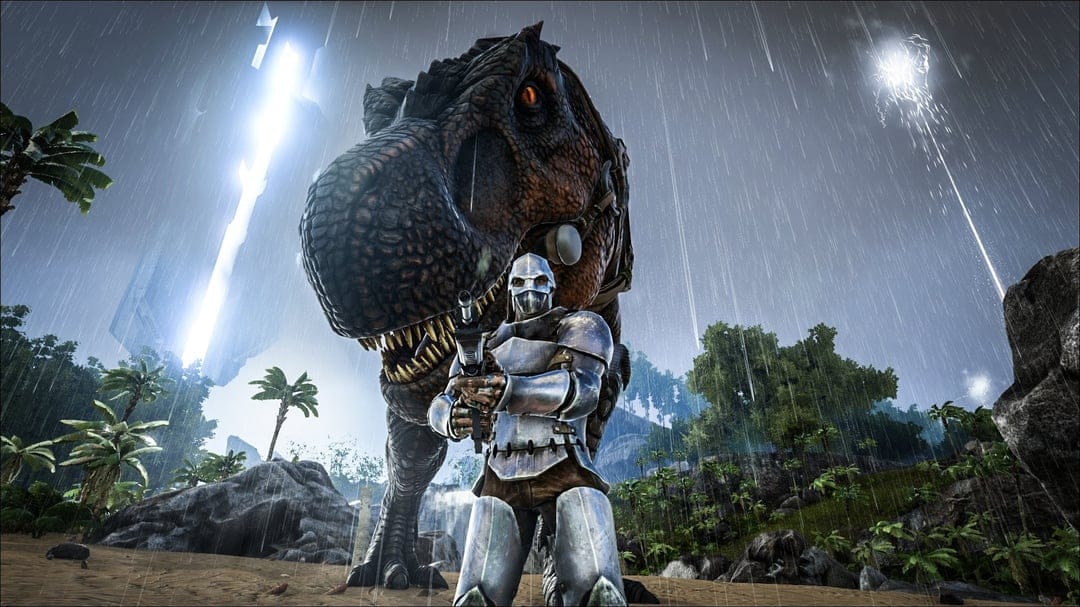 An armored warrior holds a rifle in front of a massive T-Rex on a rainy tropical beach at night.