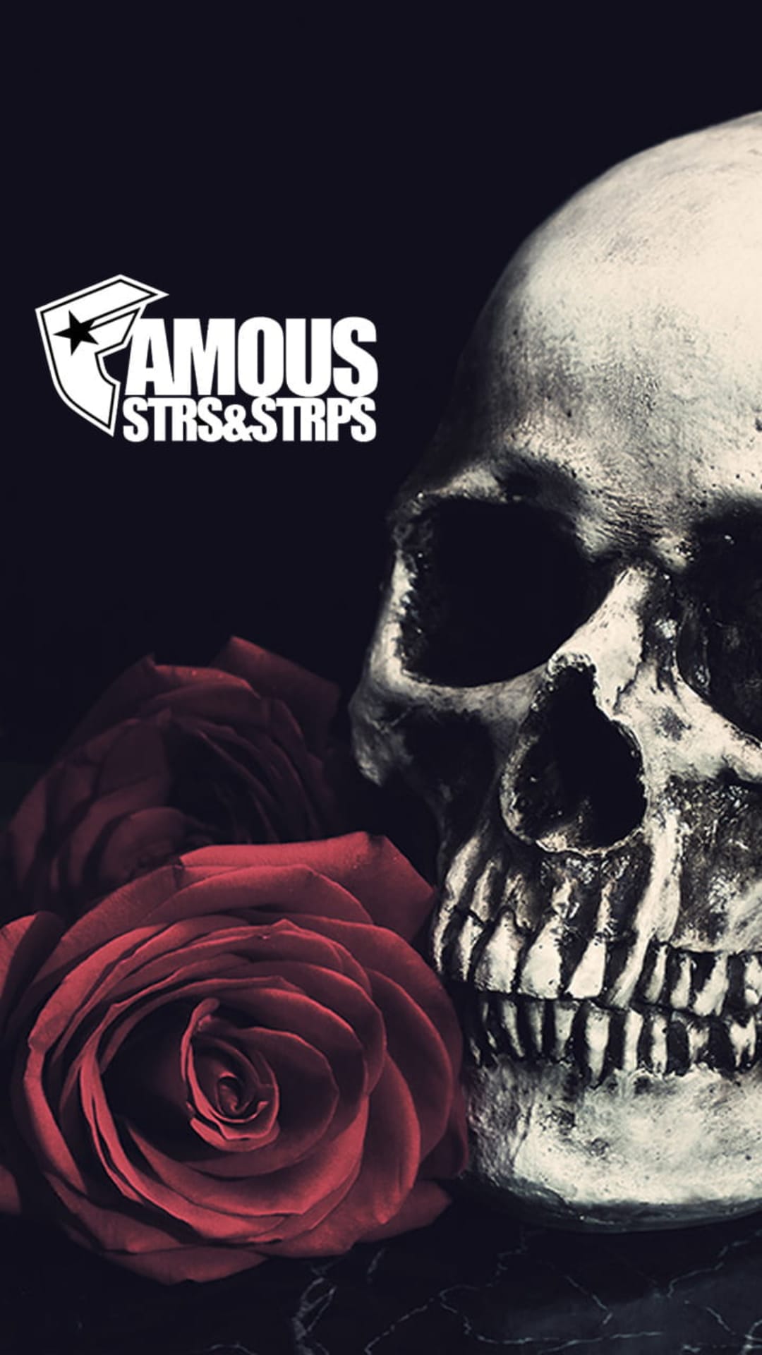 Human skull next to a blooming red rose and the Famous Stars and Straps logo on a dark, textured background.