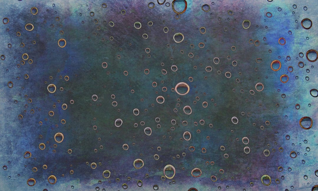 Teal and forest green grunge textures layered with small golden-rimmed circular rings and translucent bubbles.