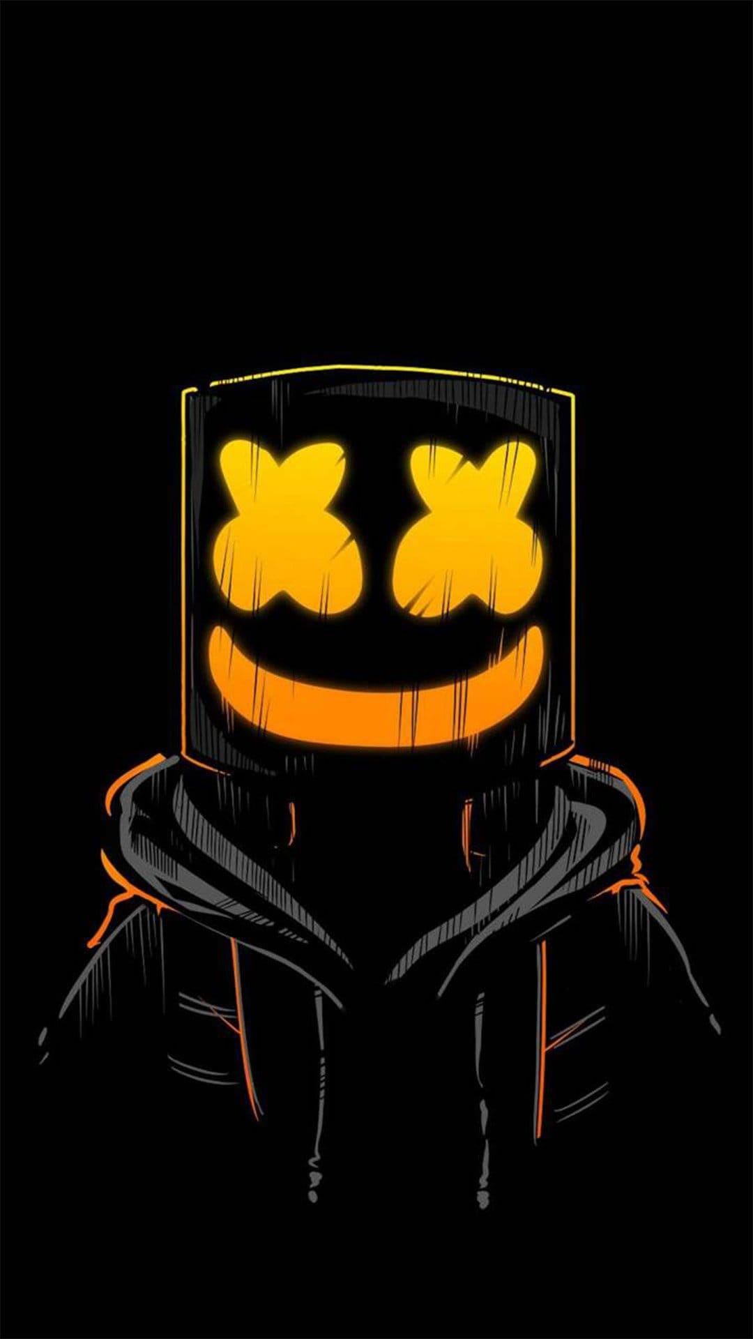 Marshmello wearing a black hoodie with a glowing orange mask featuring X eyes and a wide smile on a black background.