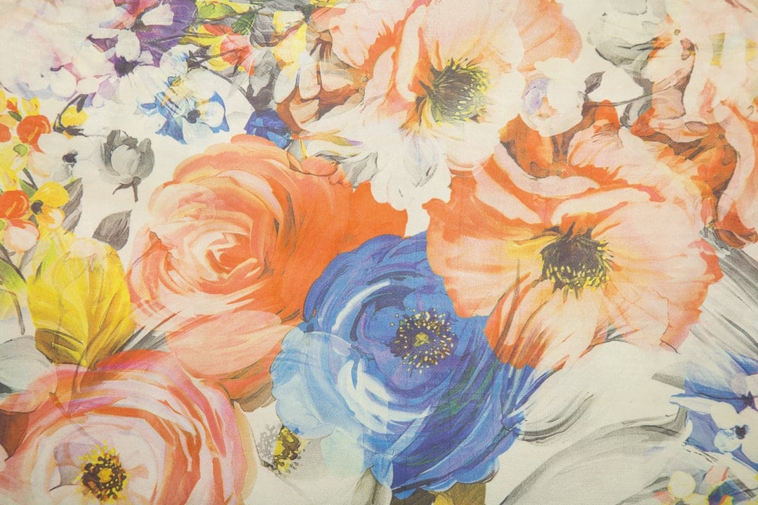 Orange and purple flowers with green stems form a dense bouquet featuring expressive painterly brushwork.