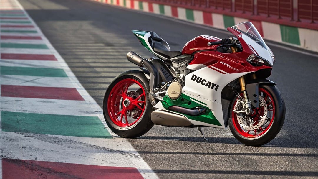 Ducati 1299 Panigale R Final Edition on a racetrack with Italian tricolore livery and red wheels.