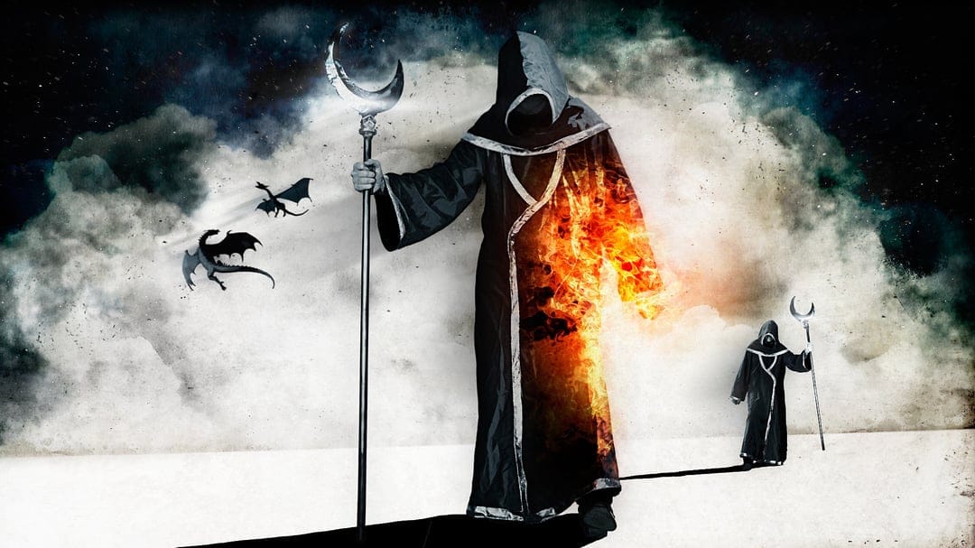 Hooded mage with a moon staff and flaming robes stands in a smoky landscape with flying dragons.