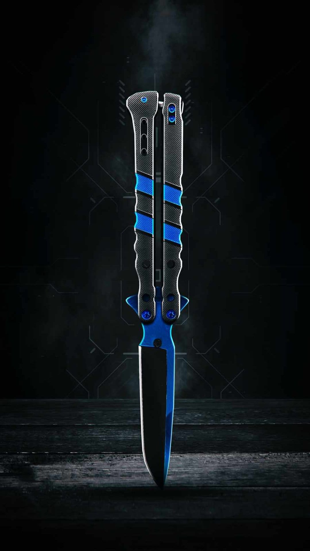 Blue butterfly knife with textured black handles on a smoky dark background with faint geometric patterns.