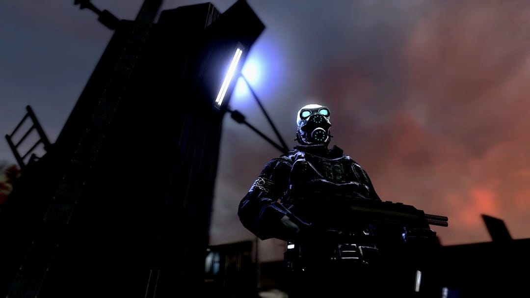 Soldier wearing a gas mask with glowing blue eyes stands against a dark orange sky beneath a bright streetlamp.