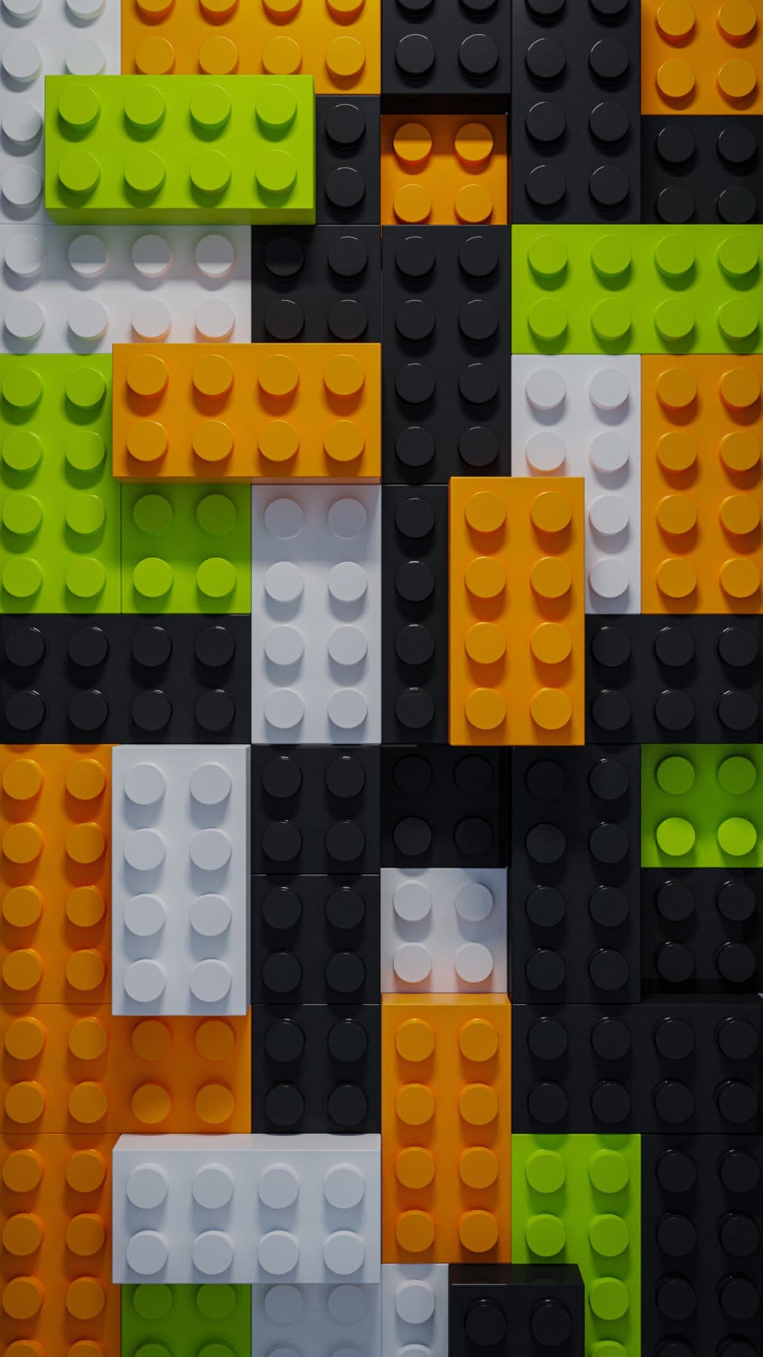 Green and orange interlocking toy blocks create a textured geometric pattern with circular studs and shadows.