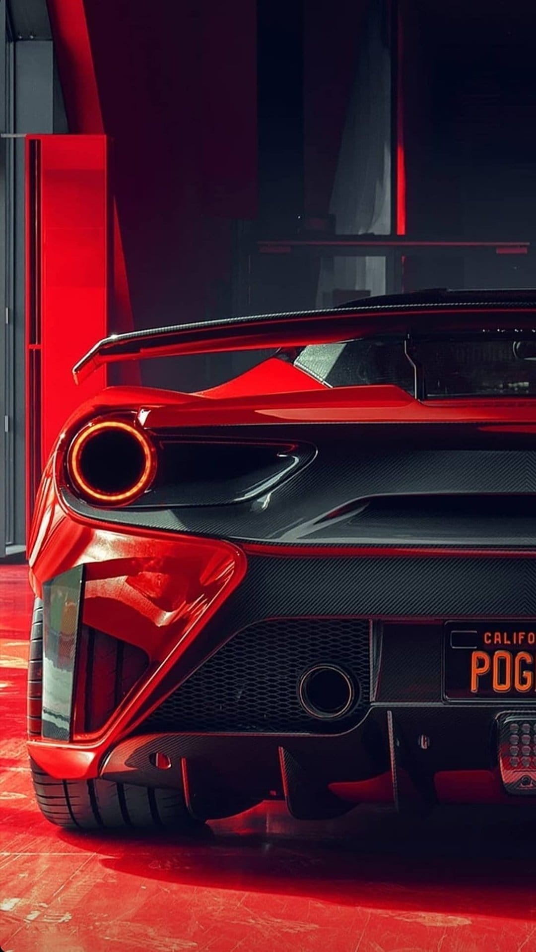 Red Ferrari tail lights glow above a California license plate with carbon fiber trim and floor reflections.