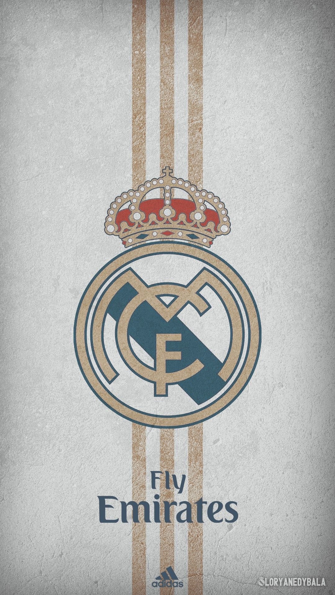 Real Madrid crest with a gold crown centered over beige stripes and a white background on a phone screen display.