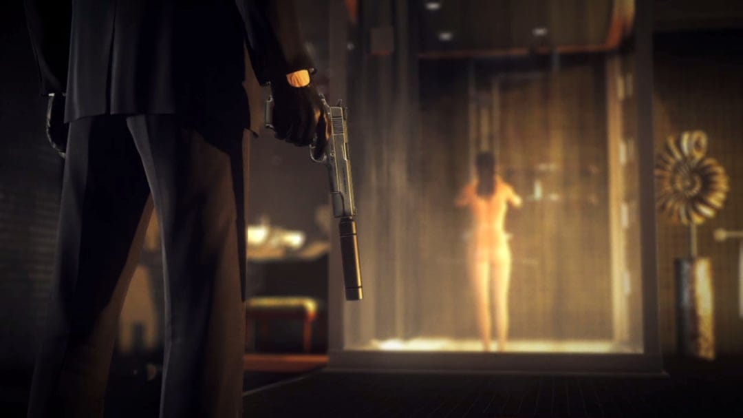 Agent 47 in a black suit holds a suppressed pistol in a dark bathroom with a steamy shower in the background.