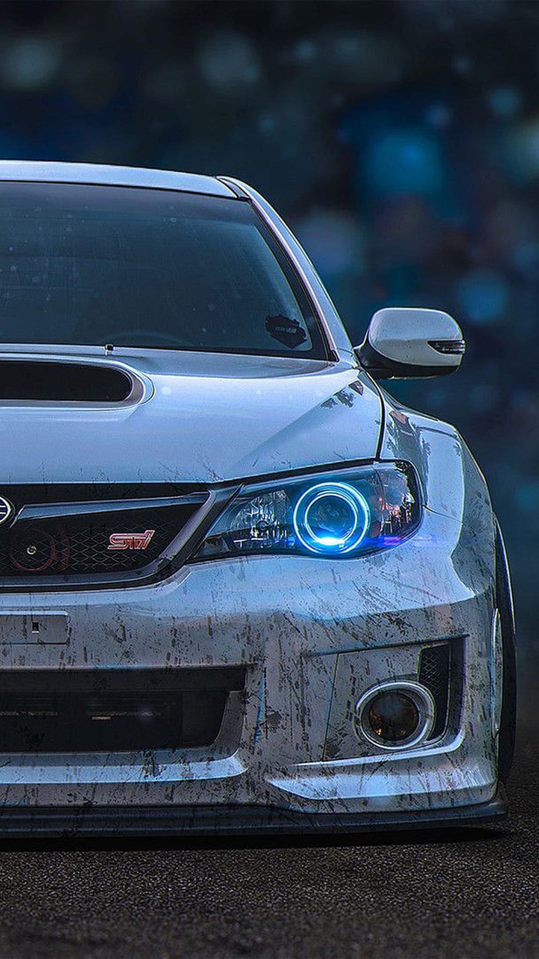 Subaru WRX STI with custom blue halo headlights and a weathered paint finish on an aggressive front bumper.