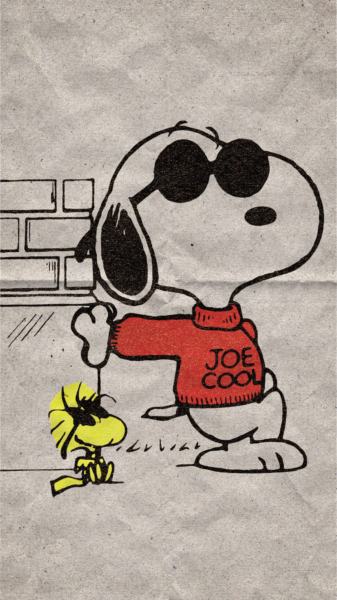 Snoopy wearing a red sweater and sunglasses stands with Woodstock against a textured brick wall background.