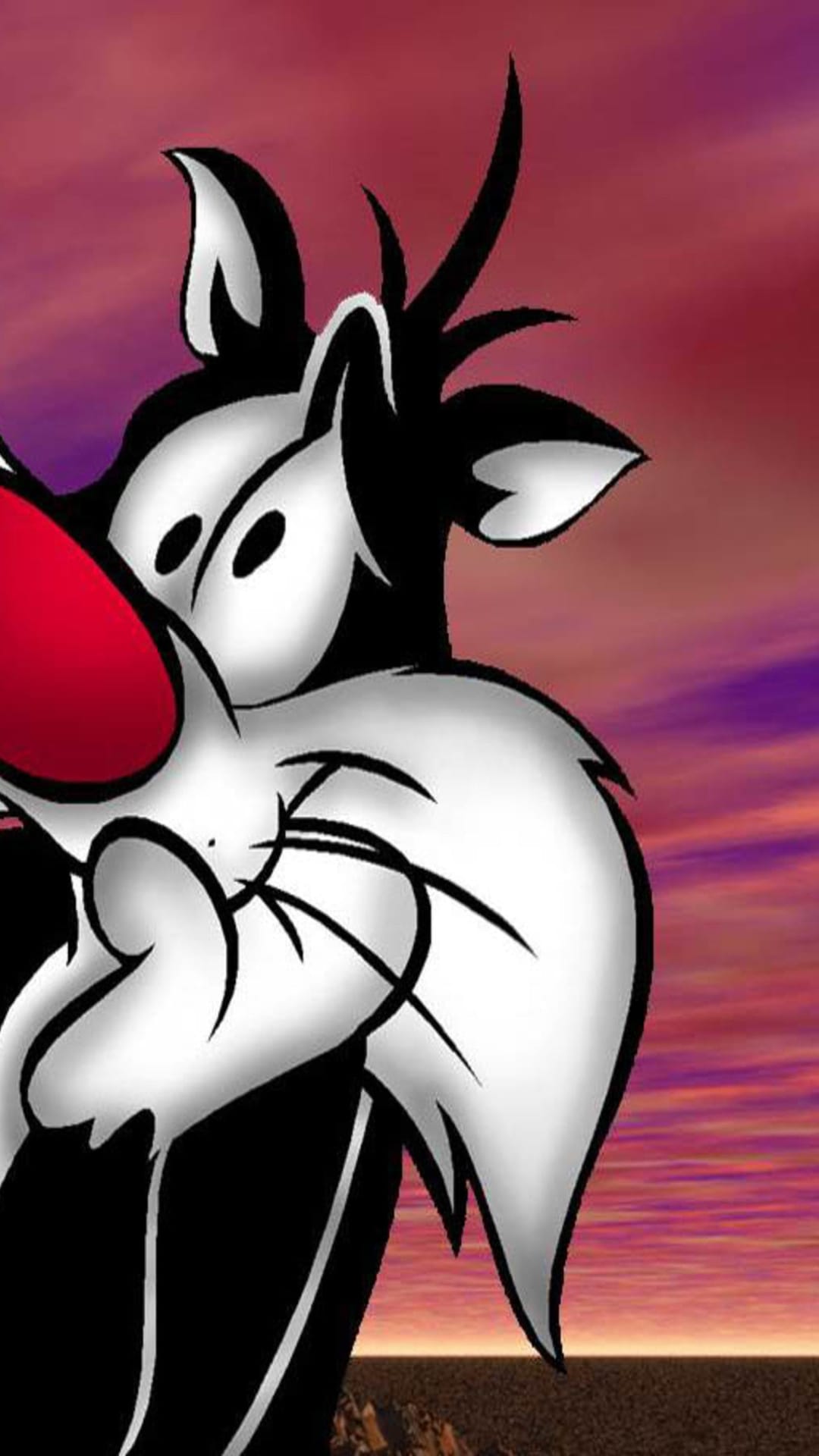 Sylvester the Cat with a large red nose and yellow eyes gazes forward against a warm, orange-hued sunset sky.