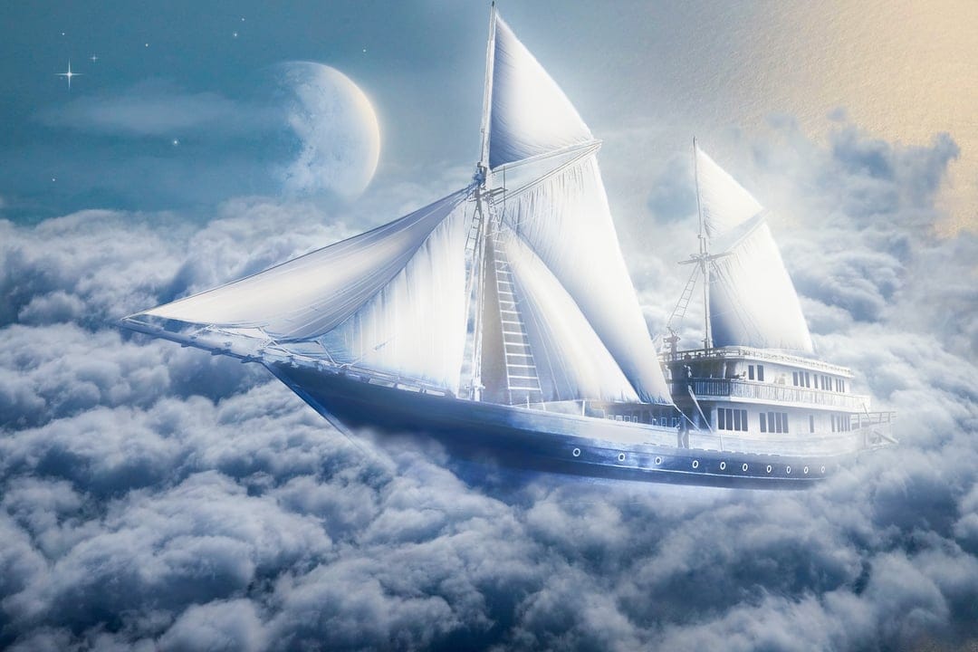 Sailboat with white sails glides through fluffy clouds under a glowing moon and a dense field of stars.
