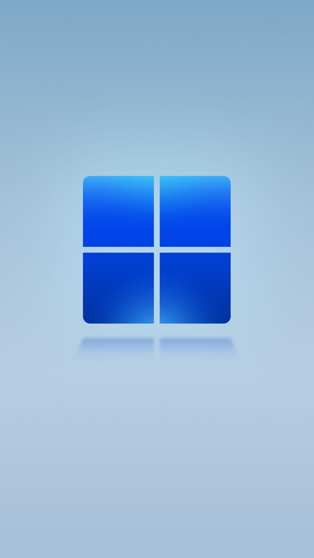 Windows 11 logo featuring four blue squares with white dividers centered over a soft blue gradient background.
