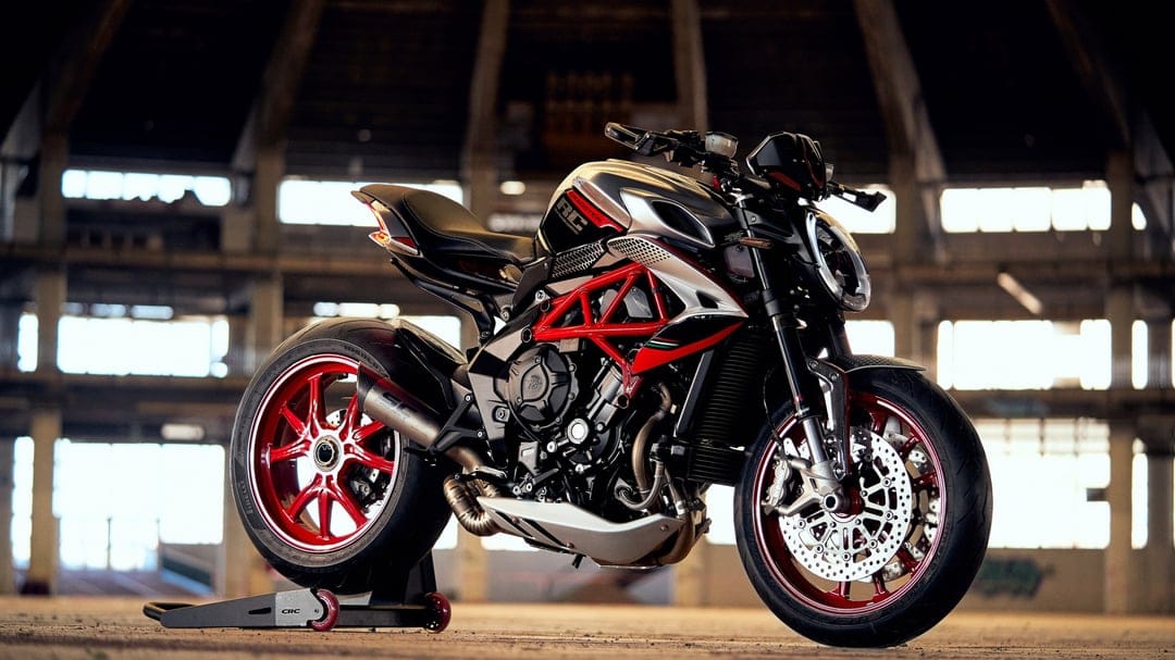 MV Agusta Dragster RC motorcycle with a red frame and wheels inside a sunlit industrial warehouse setting.