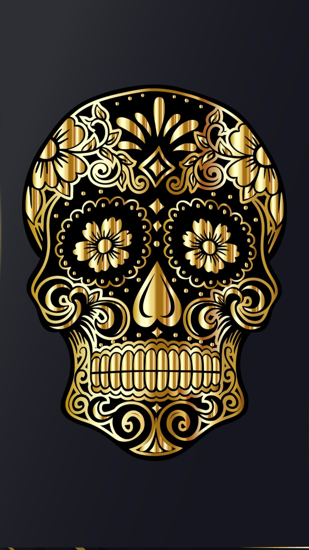 Ornate golden sugar skull with metallic floral filigree and detailed mandible set against a dark background.