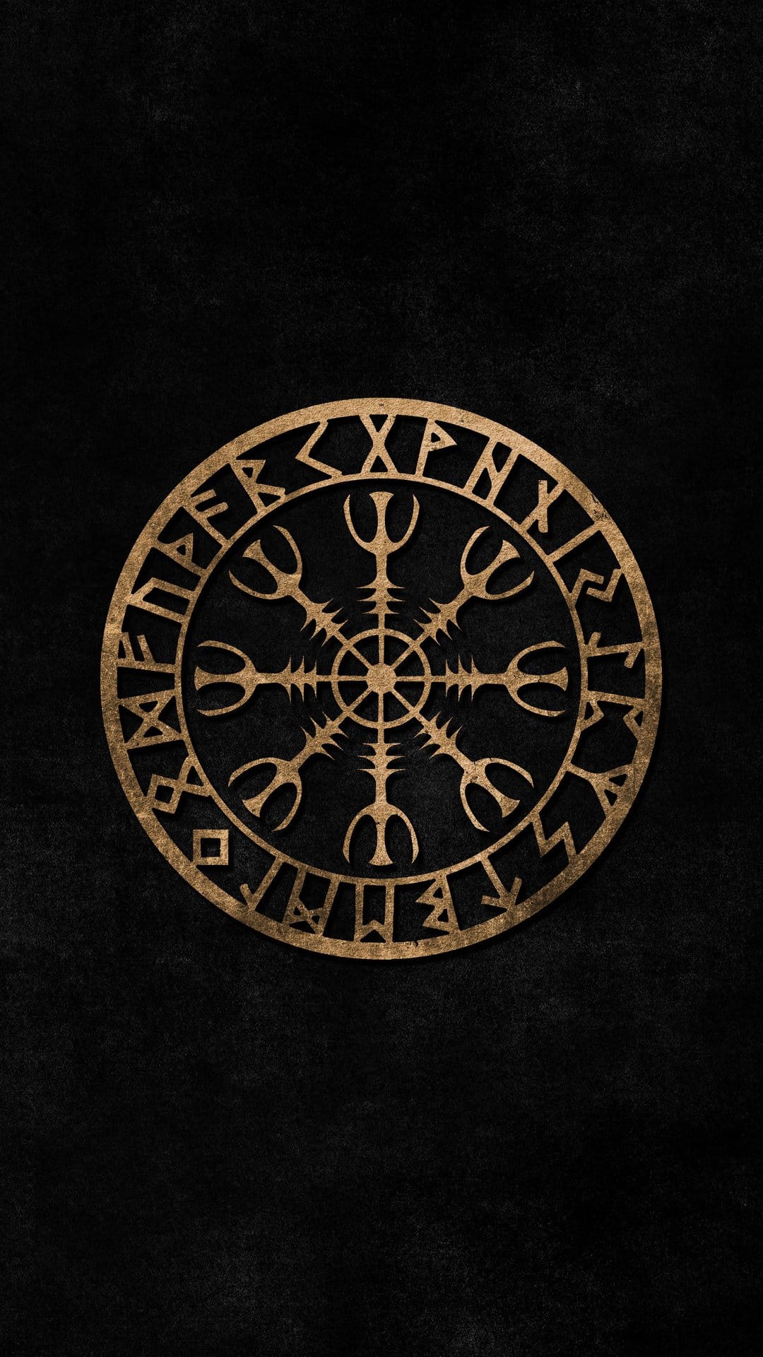 Golden Vegvisir compass with runic inscriptions centered on a dark, heavily textured stone background.
