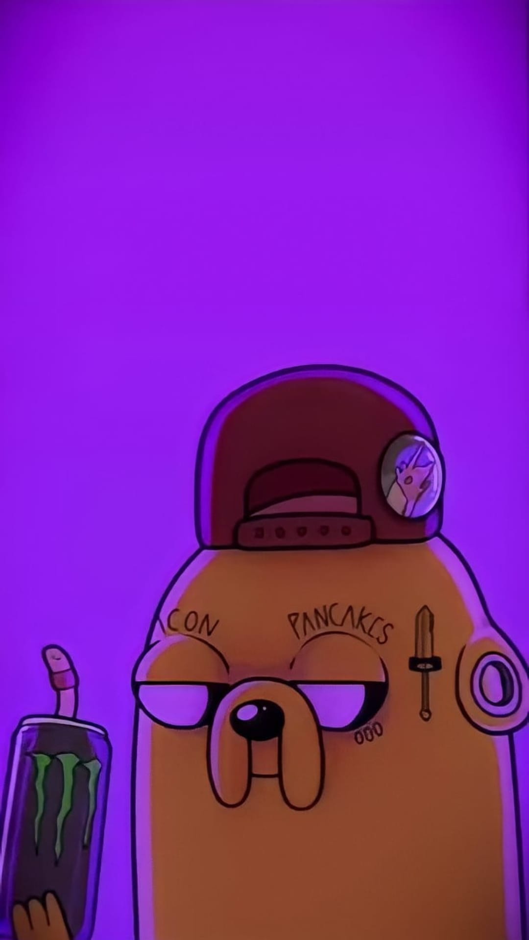 Yellow cartoon dog with face tattoos and a backwards hat holding a green energy drink can against purple.