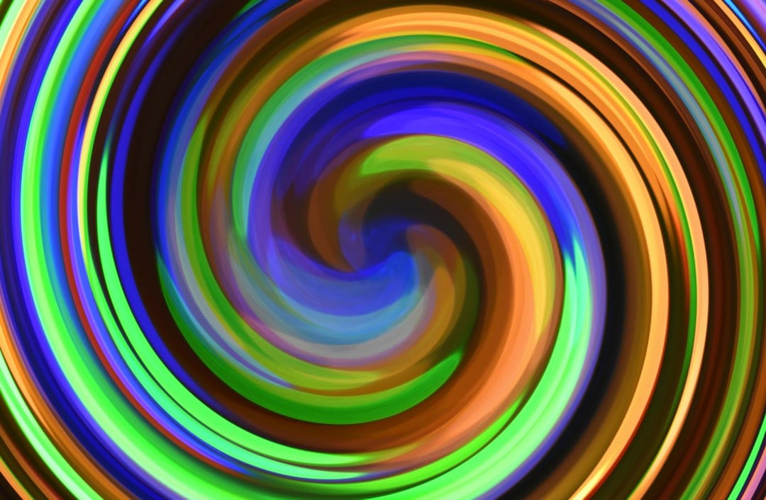 Luminous swirls of blue, orange, and green light spiral together in a fluid, high-contrast abstract vortex.