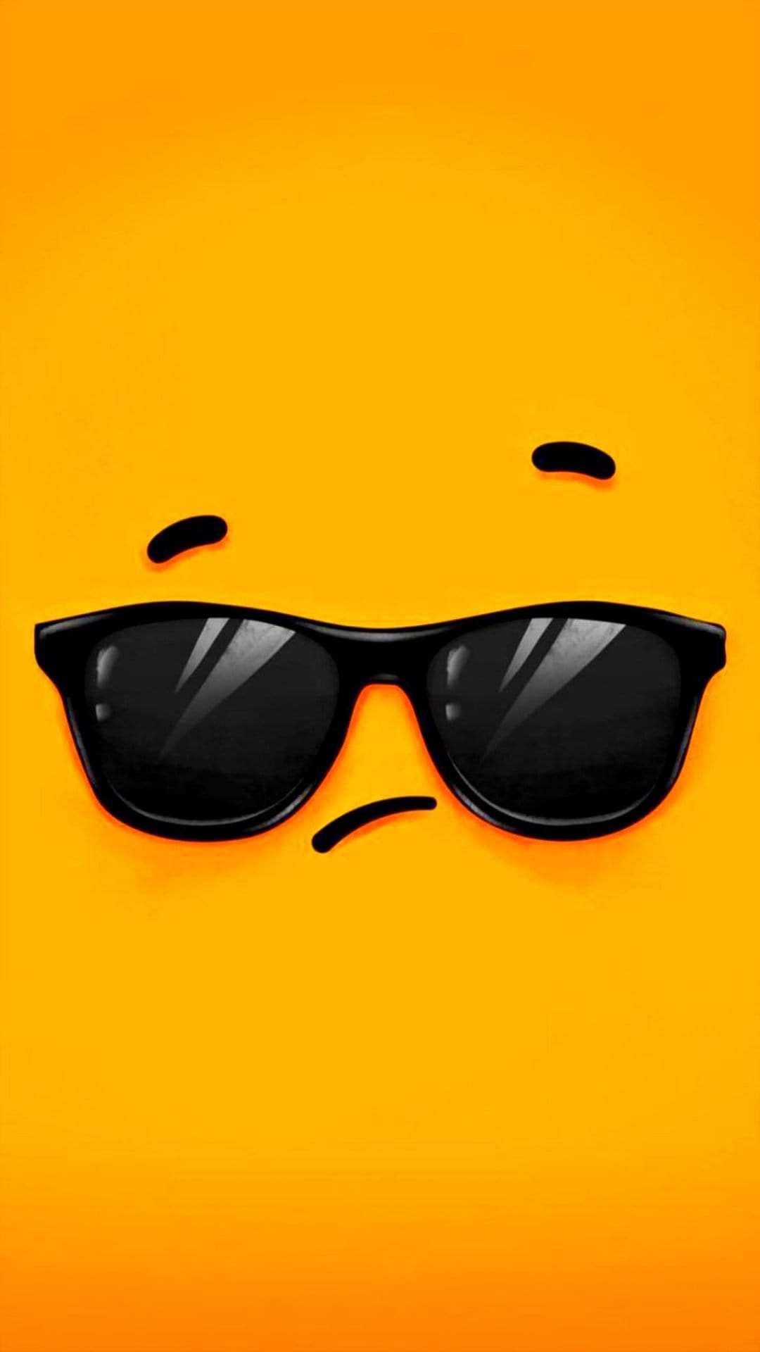 Black sunglasses with sketched eyebrows and a frowning mouth centered on a solid bright orange background.