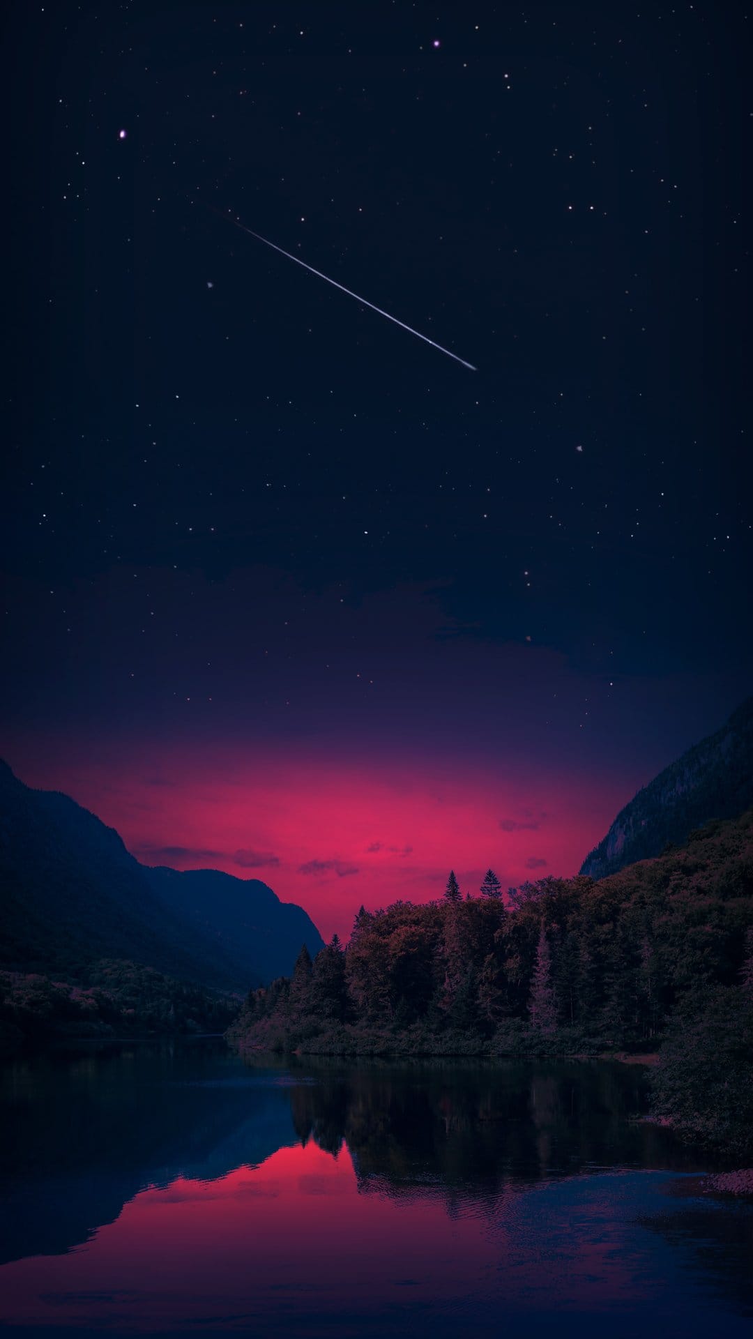 Bright meteor streaking across a starry purple night sky reflected in a calm mountain lake at twilight.