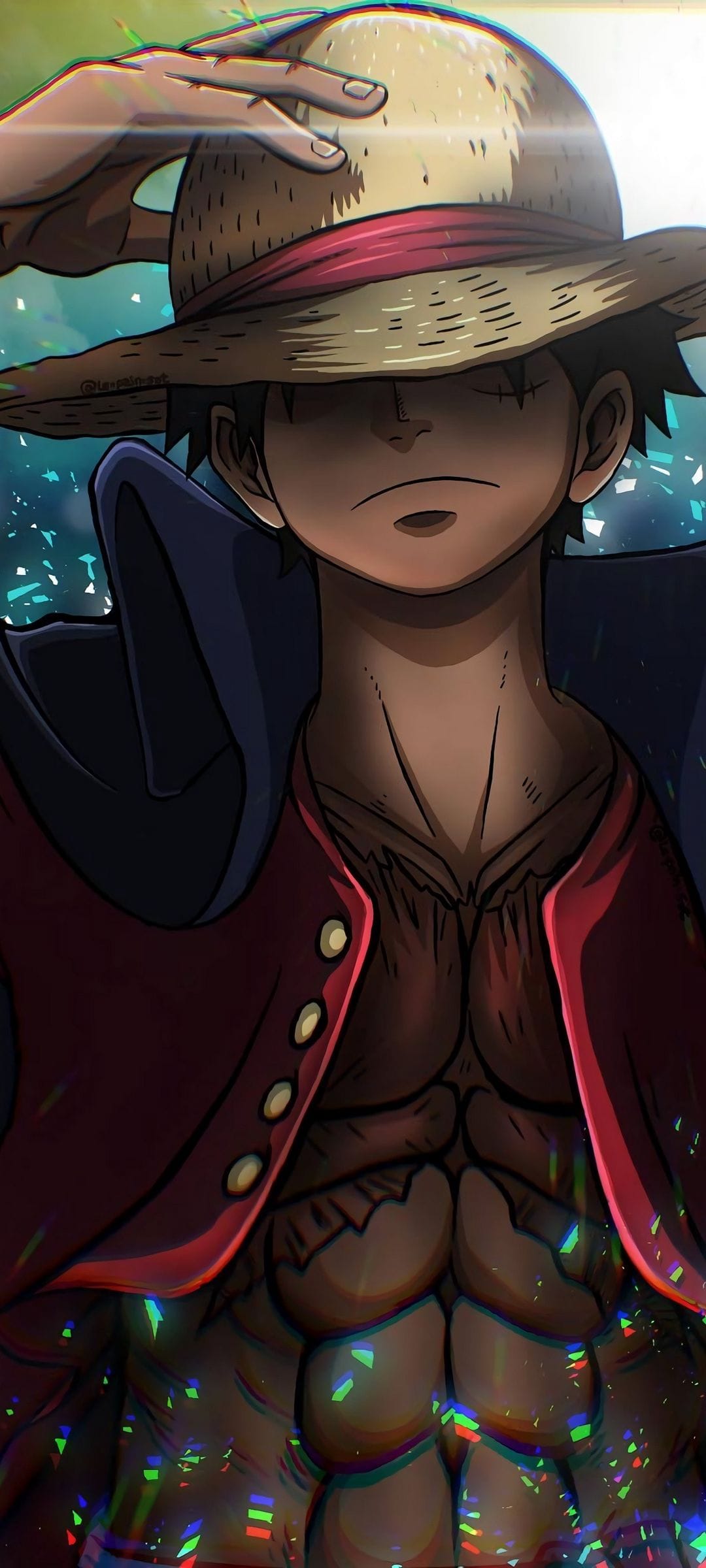 Muscular man wearing a straw hat and red jacket stands before a blue and green sparkling bokeh light background.
