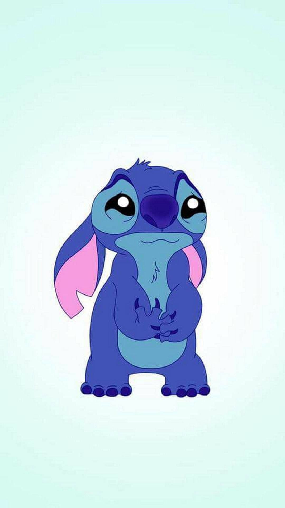 Stitch the blue alien stands with a sad expression, clasped hands, and large watery eyes on a gradient background.