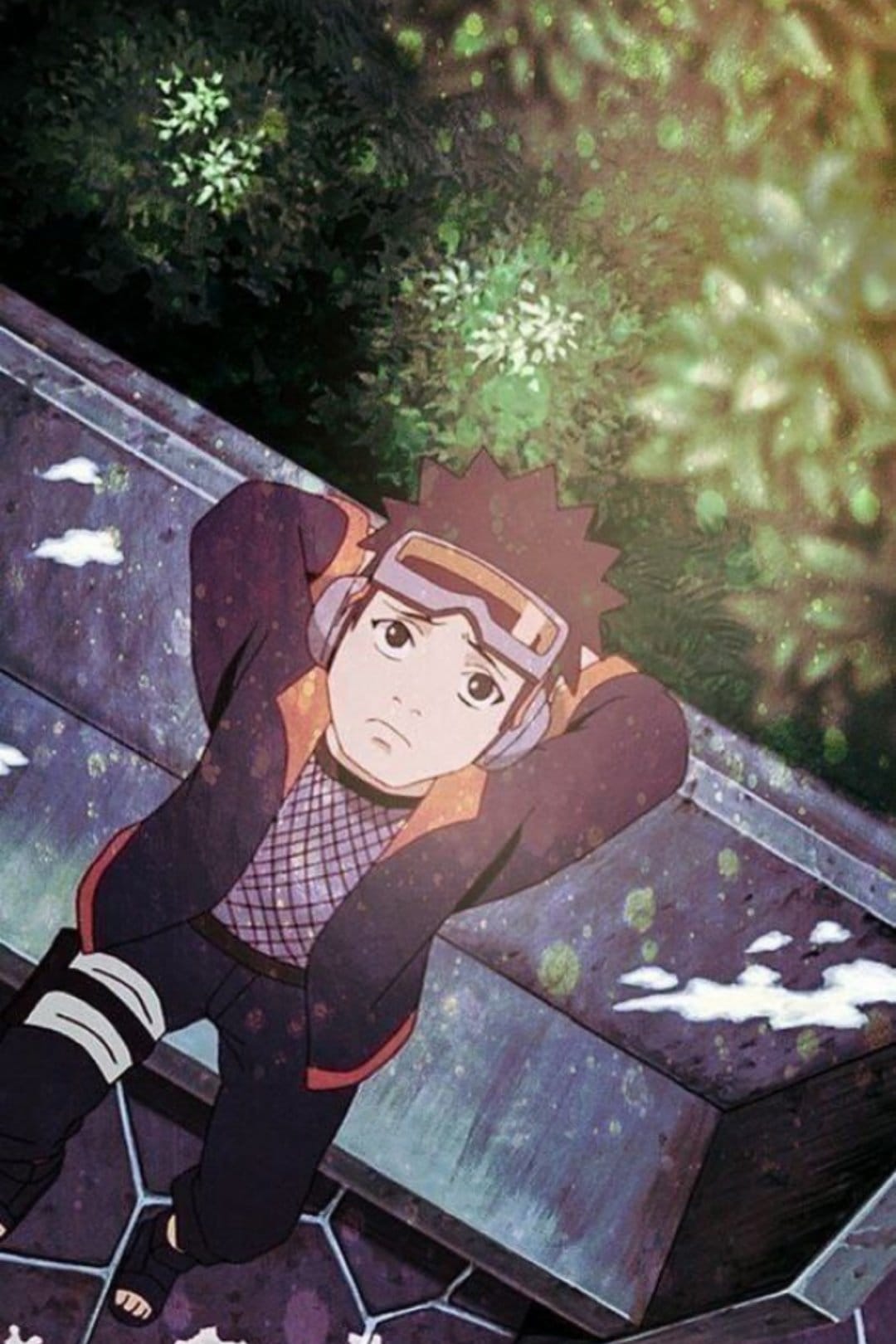 Obito Uchiha in goggles rests on textured stone while looking up at a sun-drenched green canopy and clouds.