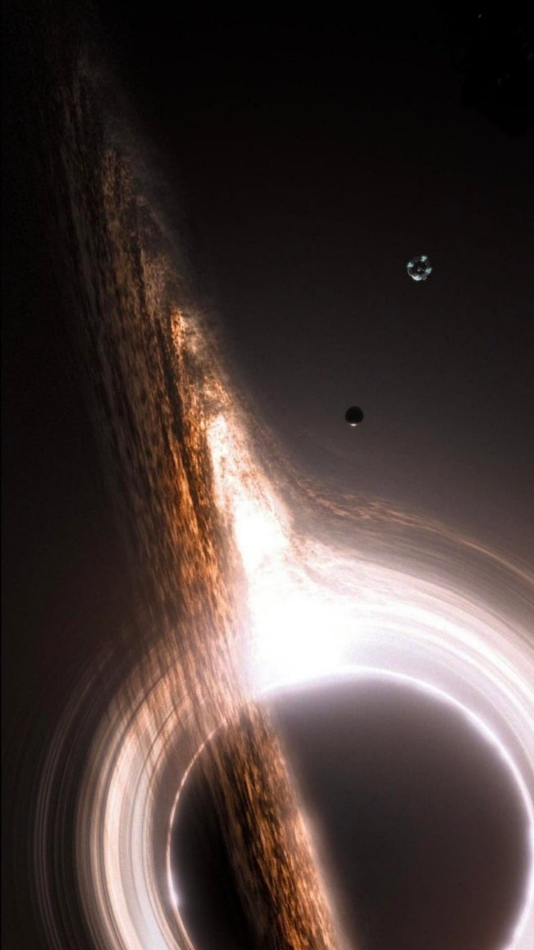 Black hole accretion disk glowing with orange light as two small objects orbit the event horizon in deep space.