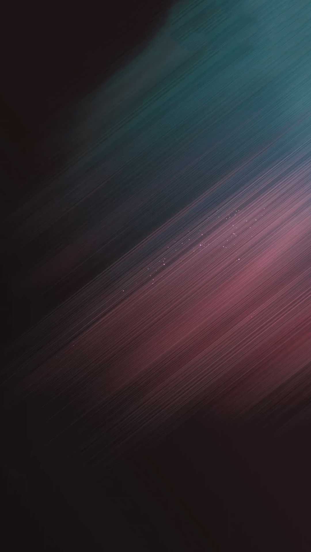 Teal and pink paint strokes layer over a dark background with small sparkling highlights and visible texture.