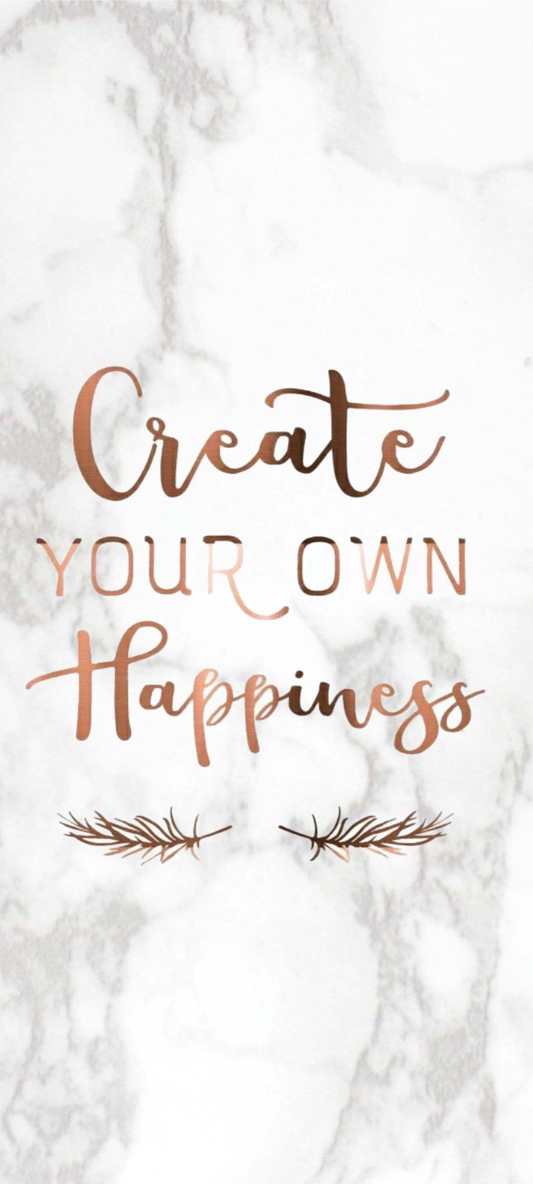 Rose gold script text reading Create Your Own Happiness on a white marble surface framed by metallic feathers.