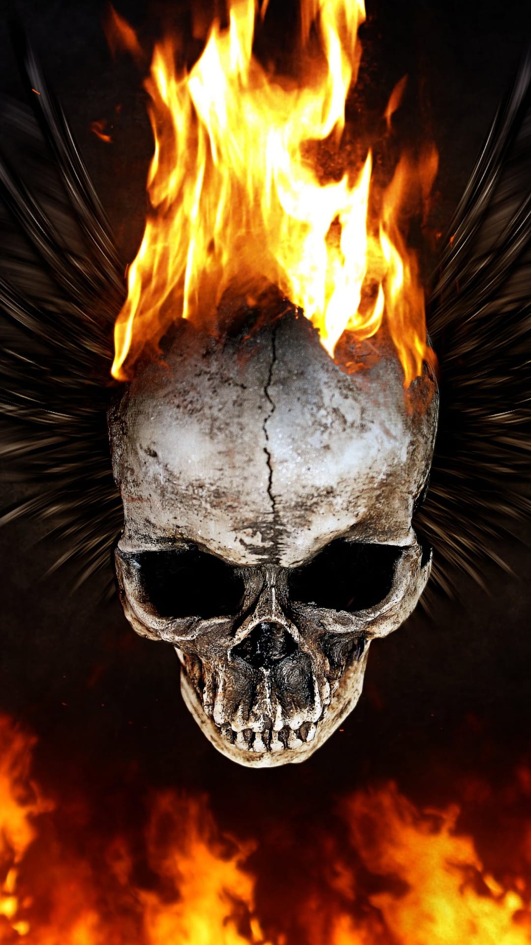 Flaming skull with bright orange fire trails and glowing eye sockets centered against a solid black background.