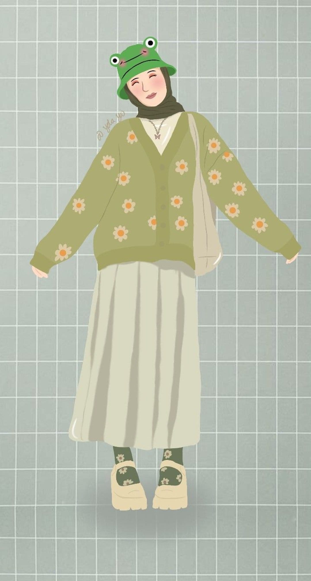 Person in a green frog hat and daisy cardigan wears a pleated skirt and Mary Janes while holding a canvas tote bag.