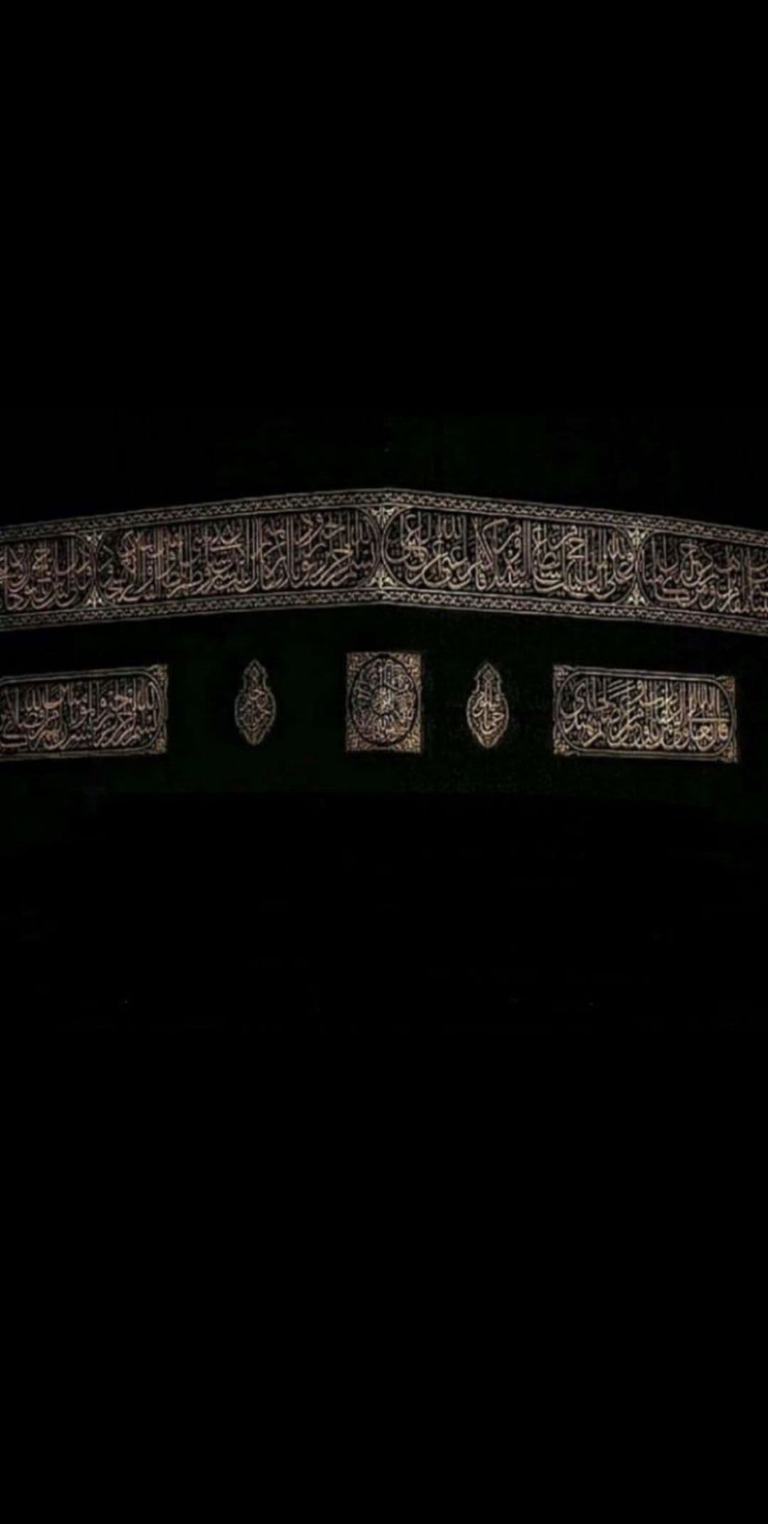 Golden Arabic calligraphy embroidered on black silk fabric with intricate floral patterns and textured threads.