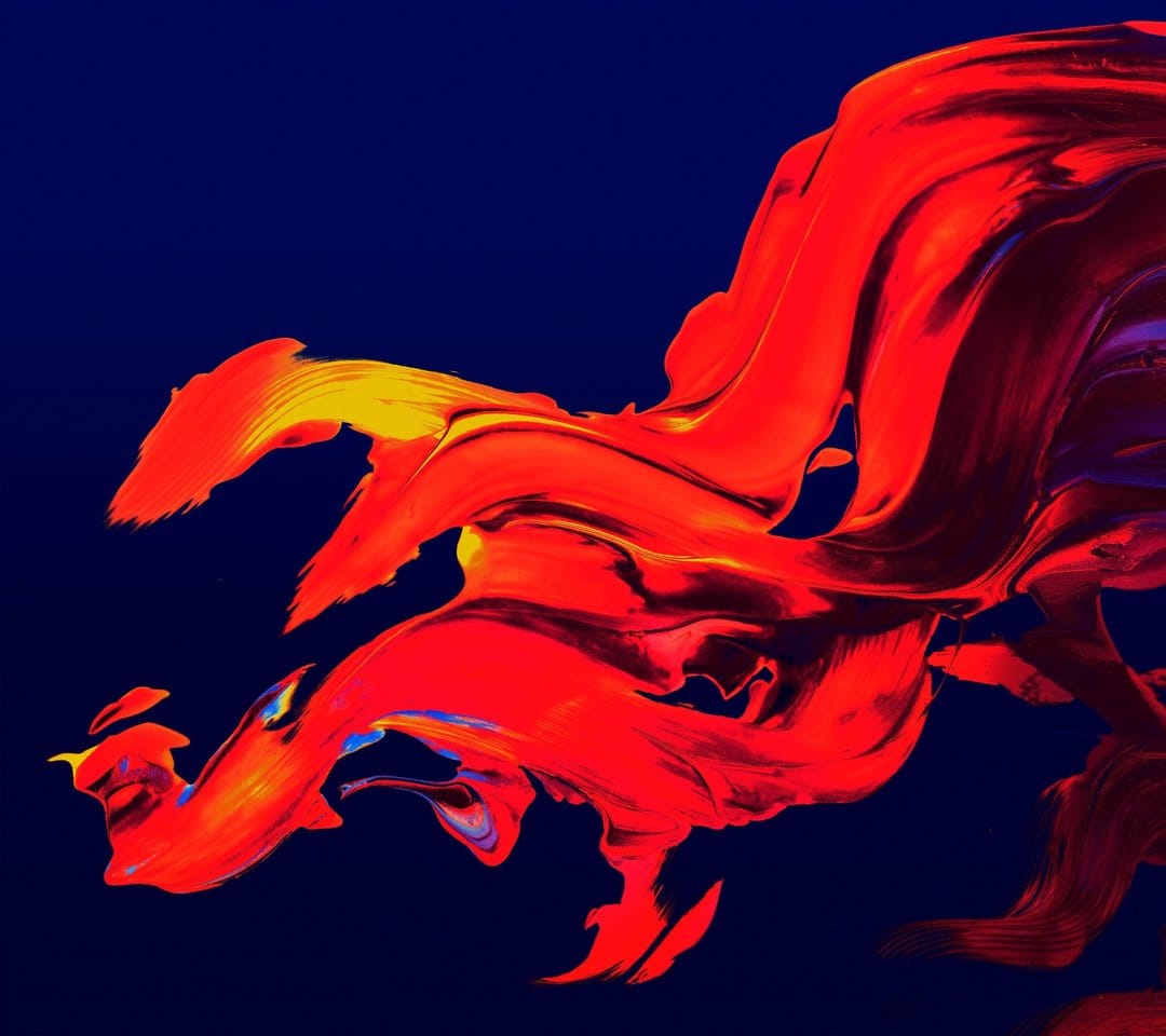 Fiery red and yellow paint swirls intertwining on a deep navy blue background with textured brushstrokes.
