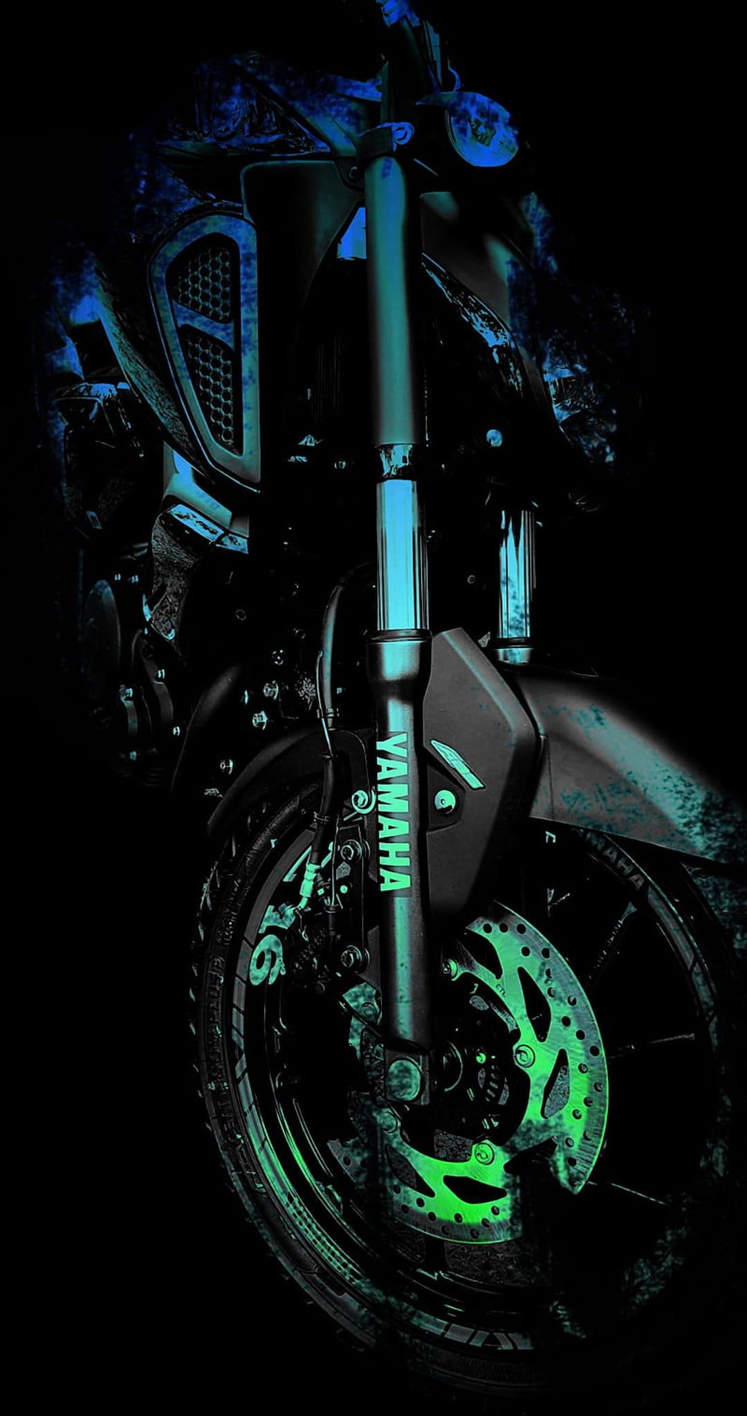 Yamaha motorcycle front fork and brake disc illuminate with vibrant teal and lime green neon light accents.