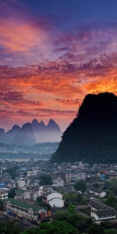 Yangshuo, China, sunset, mountains, cityscape, vibrant, nature, beautiful, natural beauty, dramatic, travel, urban, iconic, picturesque, clouds, tranquil, Asia, scenic, unique, waterfront, sky
