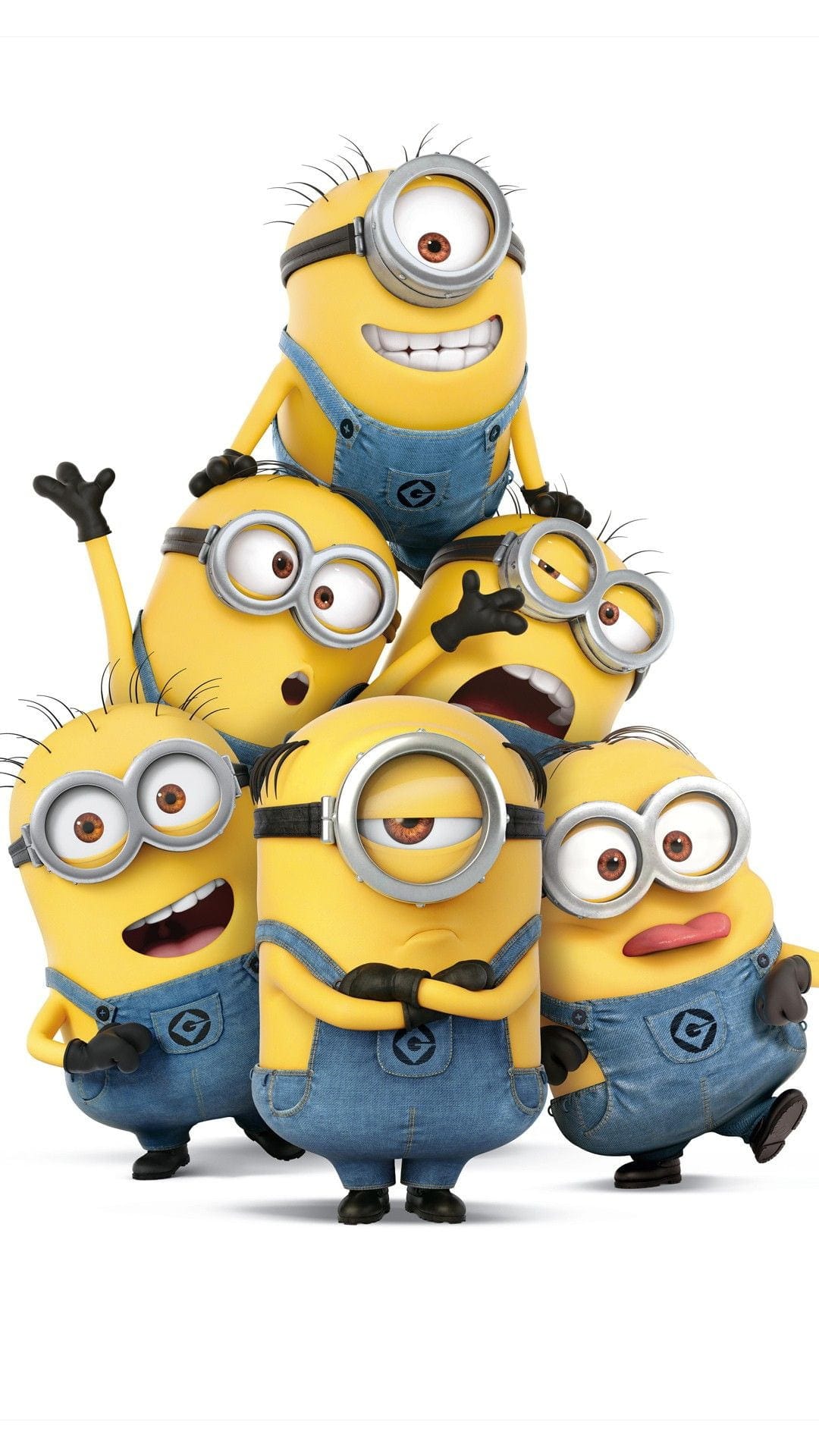 Minions wearing goggles and denim overalls pile up with funny expressions against a stark white background.