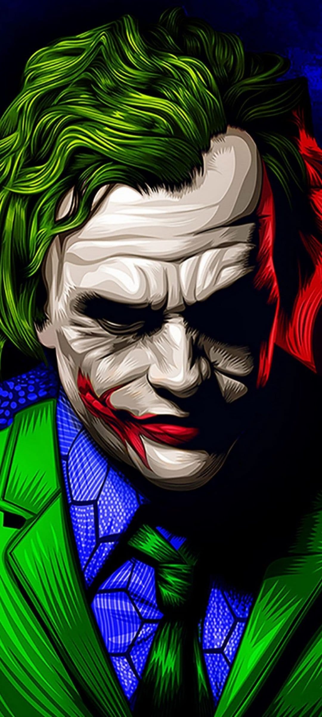 Joker with green hair and red face paint wearing a green suit and blue shirt under dramatic studio lighting.