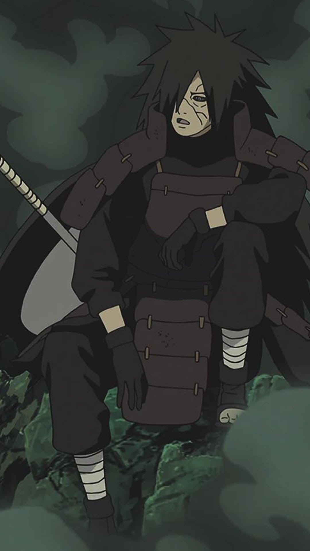 Madara Uchiha sits on rocks in dark armor with facial scars, a sword at his side, surrounded by swirling mist.