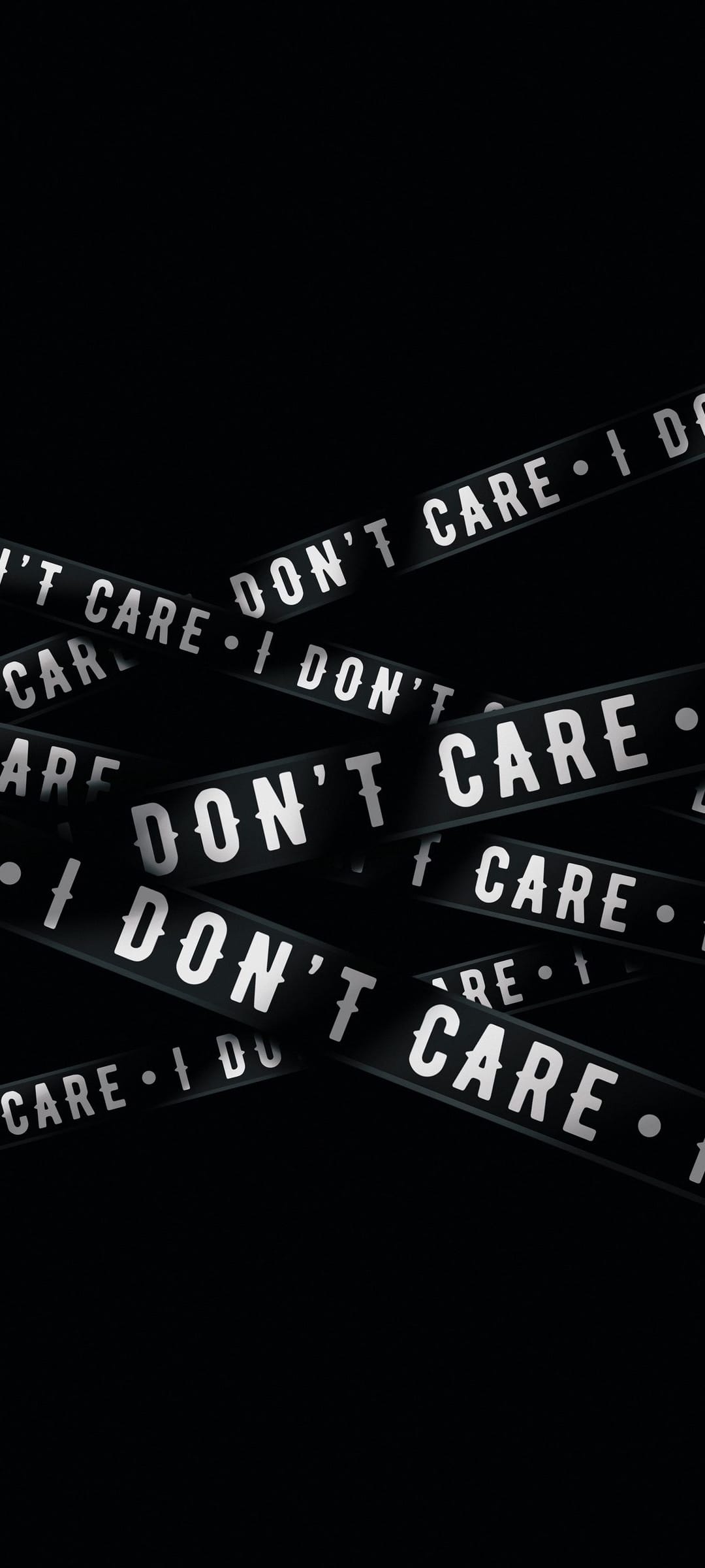 Black tape strips with white text reading DON'T CARE layered at angles against a dark, minimalist background.