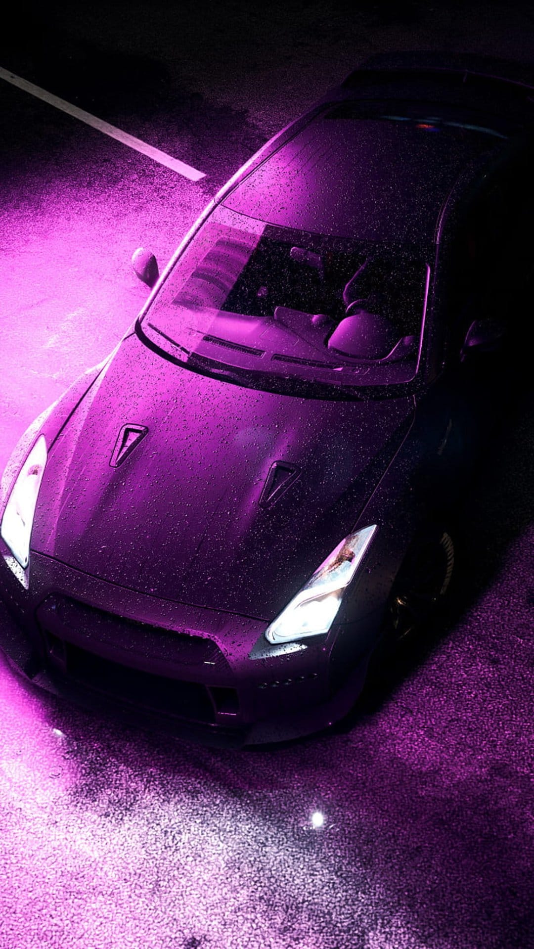 Purple Nissan GT-R parked on wet asphalt at night with violet neon light reflections and raindrops on the car.