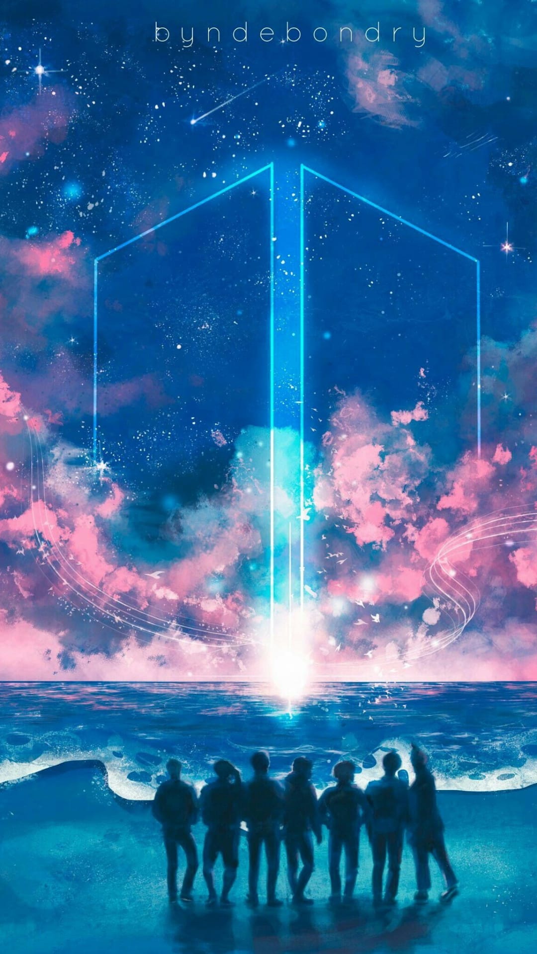 Human silhouettes stand on a dark beach gazing at a massive pink nebula and star-filled sky over calm ocean water.