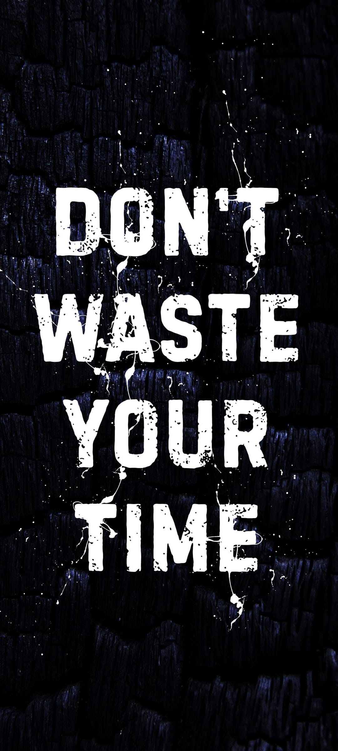 Bold white text saying Don't Waste Your Time sits on a dark charred wood background with white paint splatters.