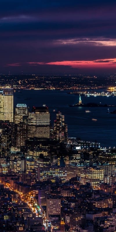 New York City, skyline, night, urban, illuminated, harbor, iconic, travel, USA, buildings, cityscape, reflections, vibrant, serene, metropolitan, dramatic, beautiful, architecture, Statue of Liberty, twilight, panorama