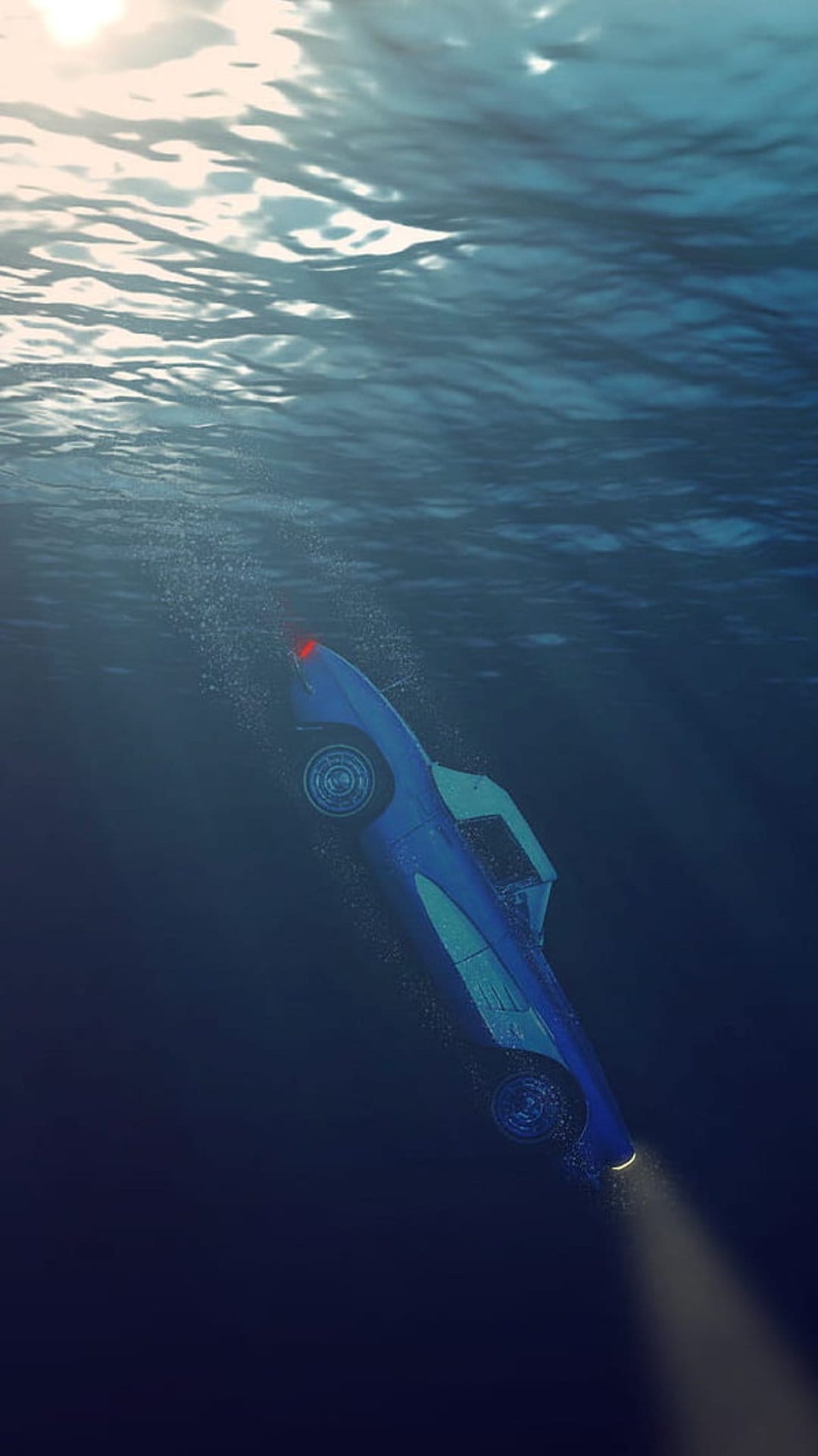 Blue car submerged on the ocean floor with sunlight rays filtering through water and a glowing red taillight.